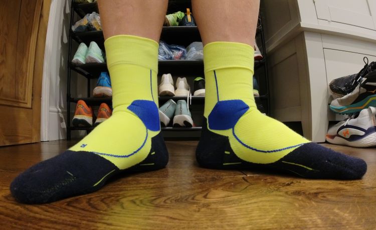Close-up of a man's feet wearing running socks