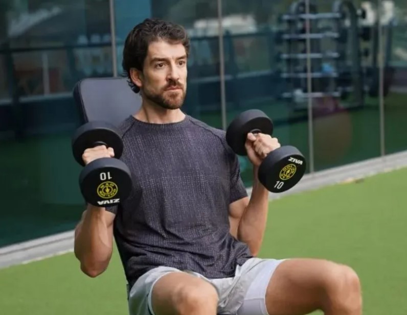 Close-up of a man performing a dumbbell hammer curl