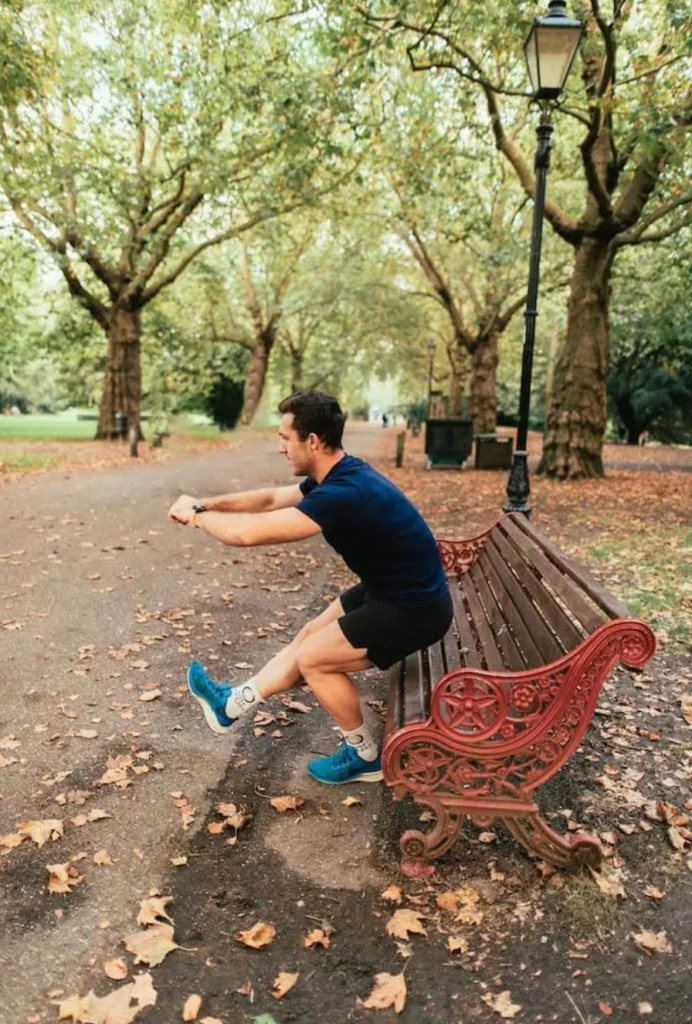 Man performing a single-leg squat on a bench