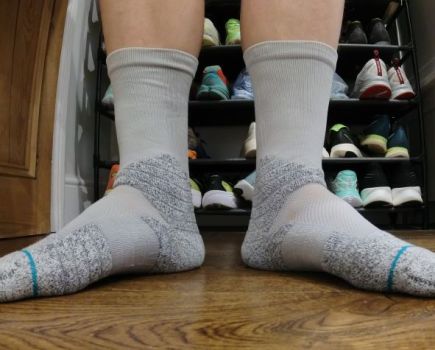 Close-up of a man's feat wearing running socks