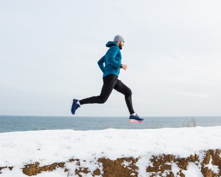 man running in the snow