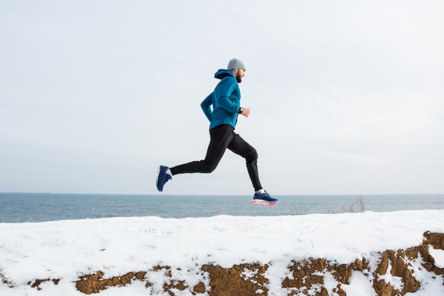 man running in the snow