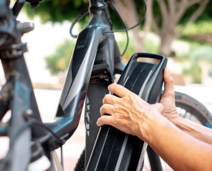 Close-up of an e-bike battery being removed