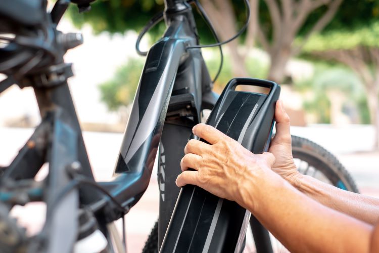 Close-up of an e-bike battery being removed