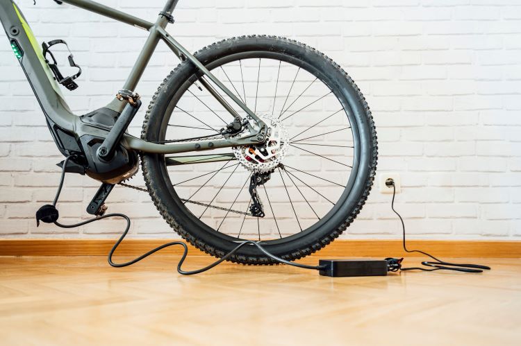 Electric bike being charged indoors