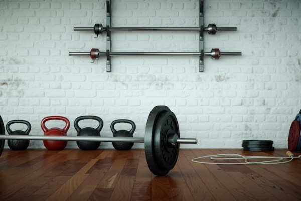 gym floor with barbell and kettlebells