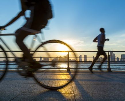 Cyclist and runner going in opposite directions