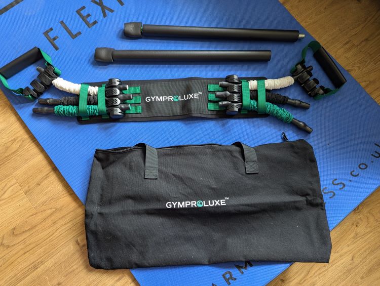 Glyproluxe band and bar set on an exercise mat