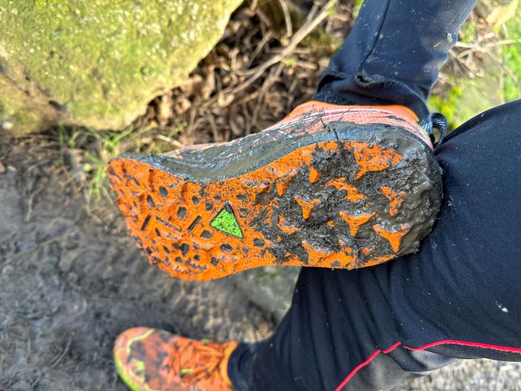 Asics Fujispeed 2 trail shoes covered in mud