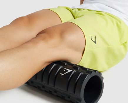 man using the Gymshark foam roller