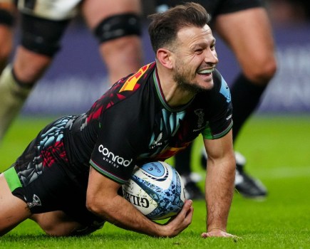 Rugby player Danny Care smiles as he scores a try