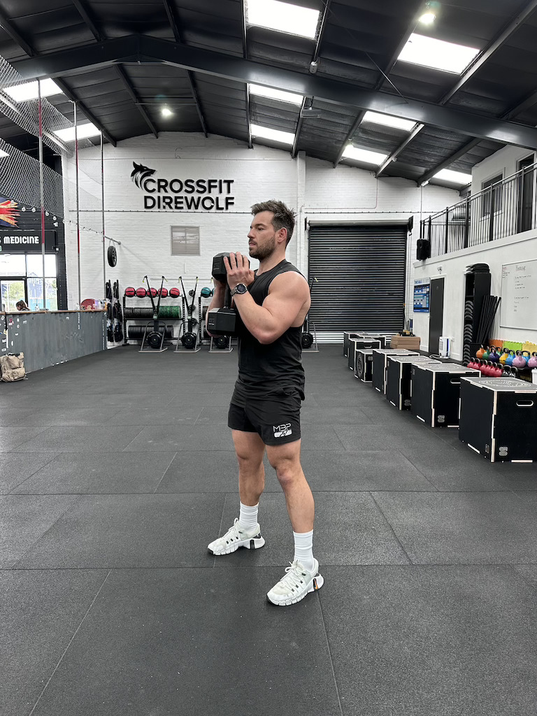 man performing dumbbell goblet squat