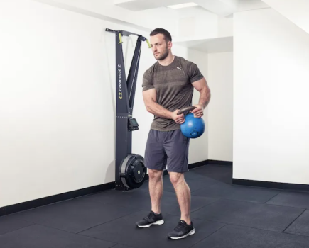 Man performing kettlebell abs exercises