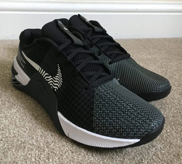 A pair of Nike Metcon 8 gym shoes