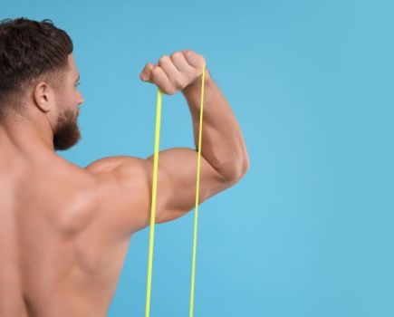 Man performing resistance band press