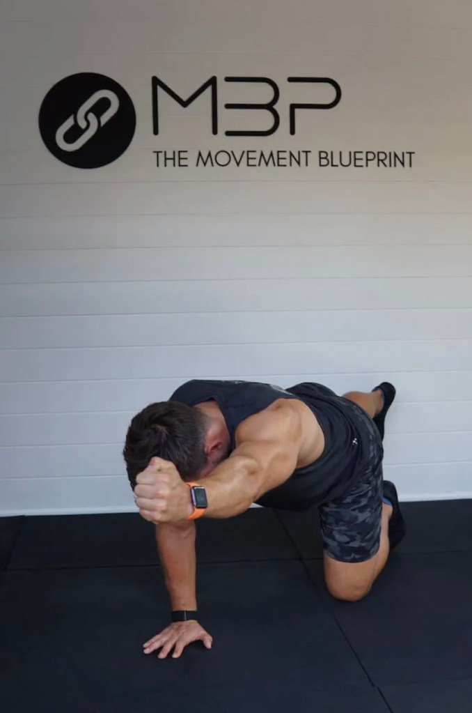 Man performing bird dog exercise