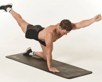 Man performing a bird-dog stretch