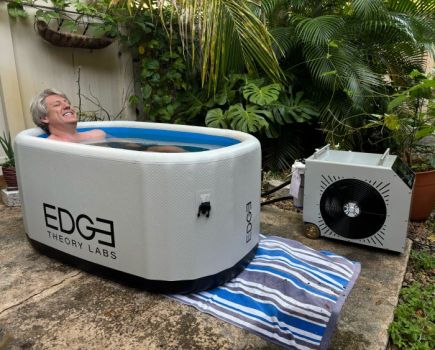 A Man using the Edge Tub Elite in his garden