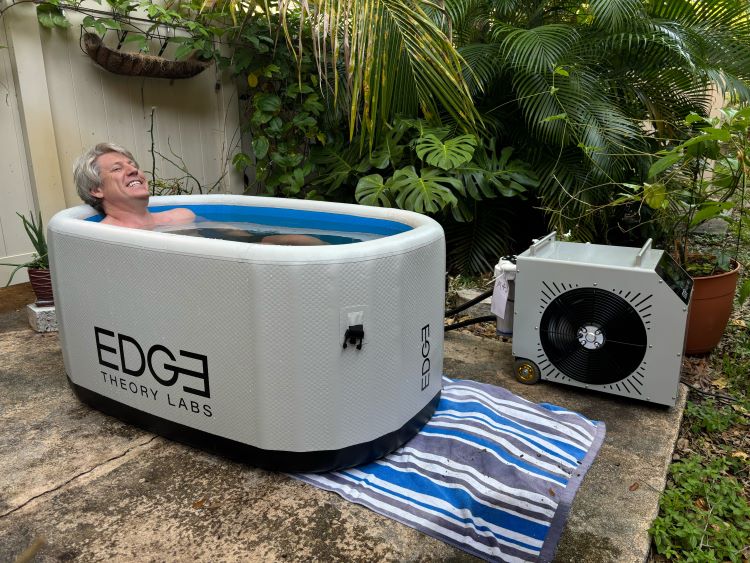 A Man using the Edge Tub Elite in his garden