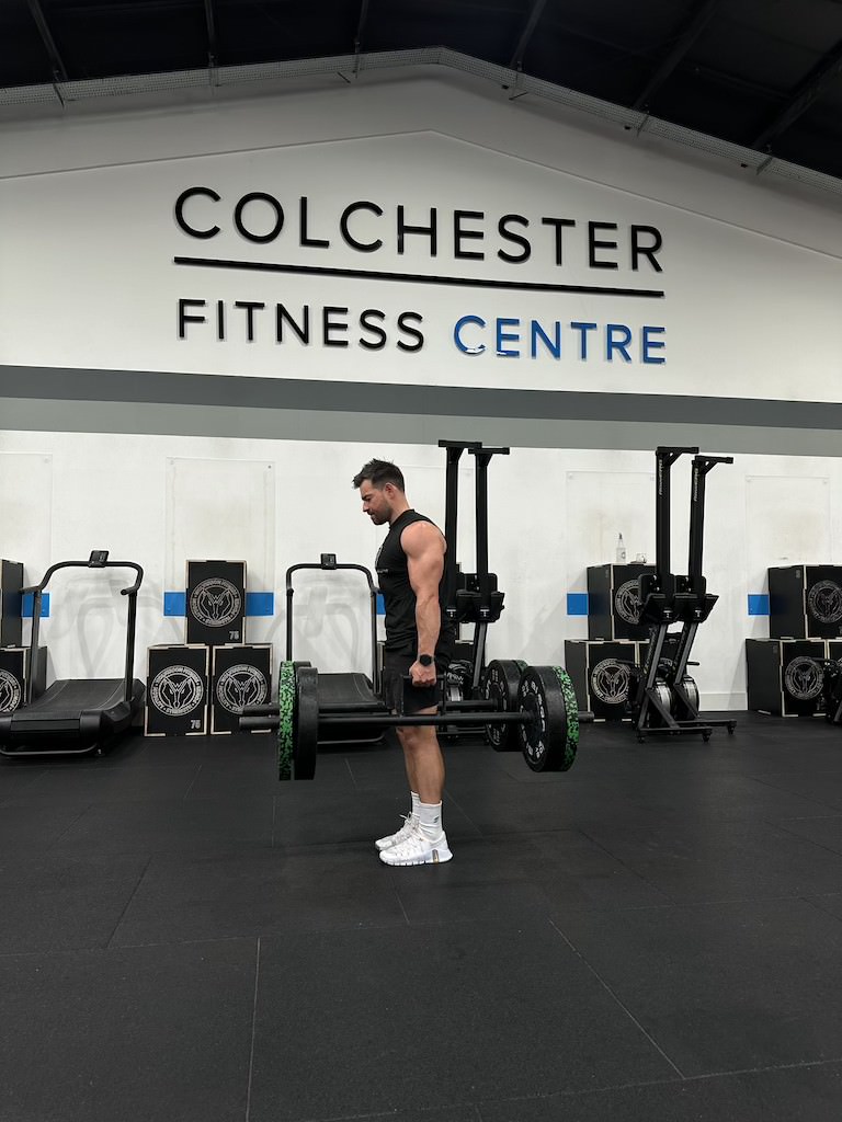 PT Harvey Lawton demonstrating how to do a barbell farmer's carry