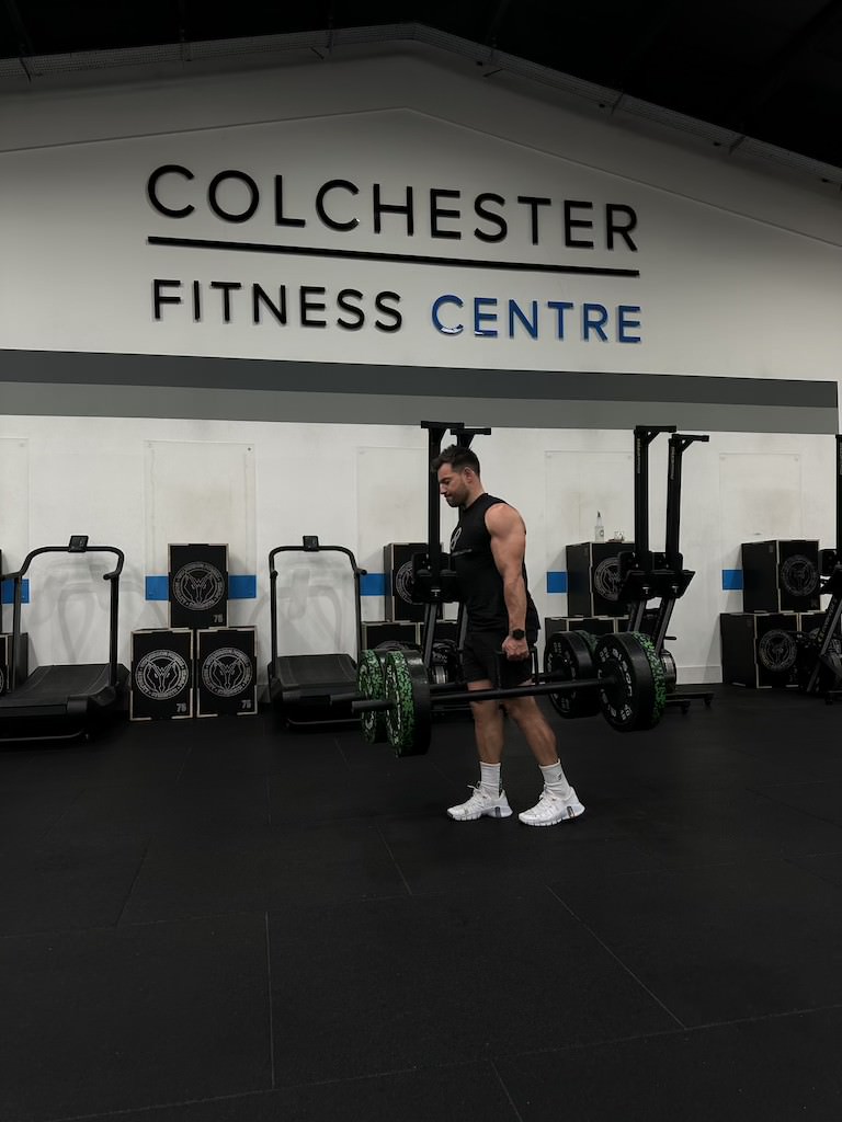 PT Harvey Lawton demonstrating how to do a barbell farmer's carry