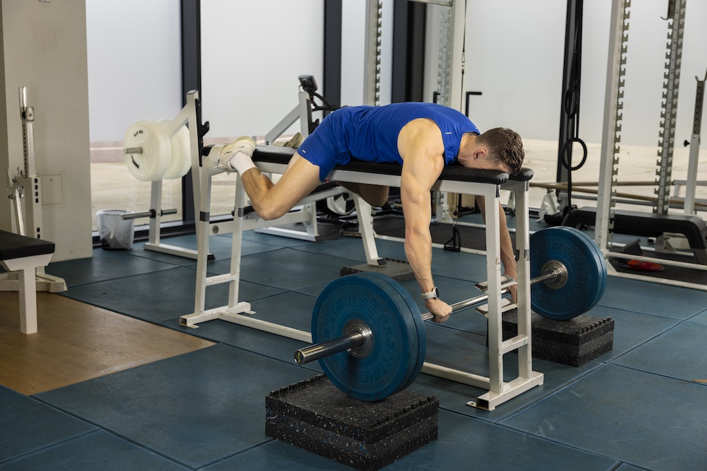 Olympic athlete Joe Clarke demonstrating a barbell bench pull