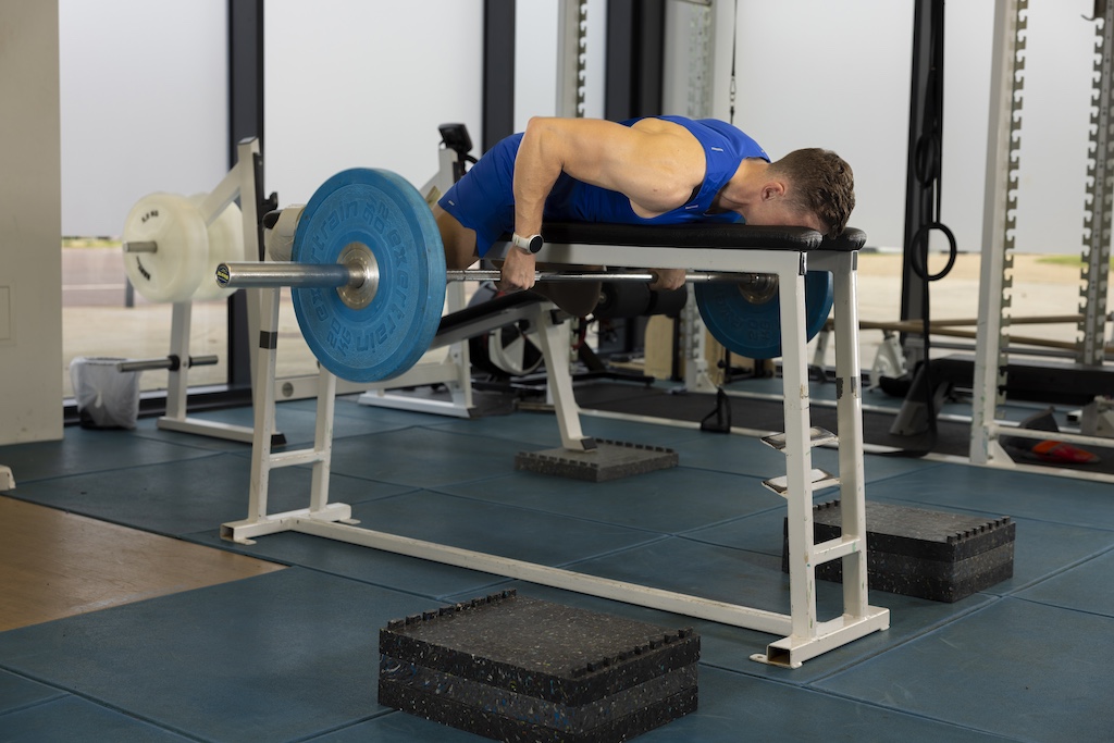 Olympic athlete Joe Clarke demonstrating a barbell bench pull