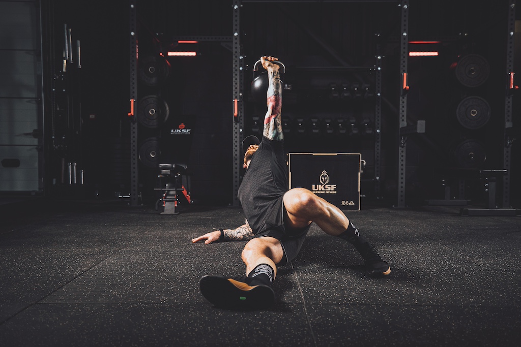 Anthony Stazicker demonstrating how to do a Turkish get-up