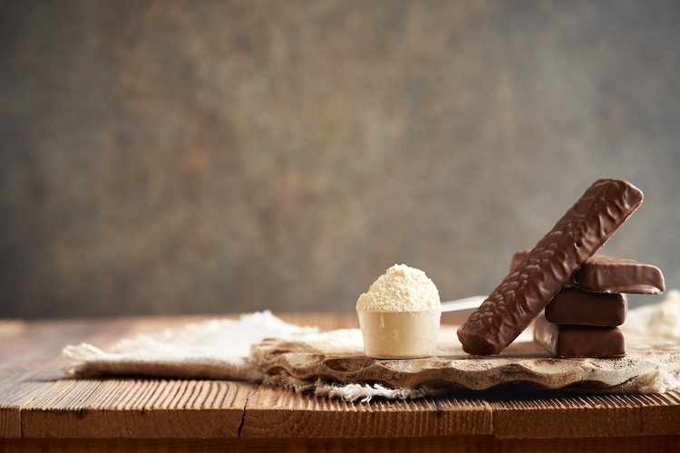 Protein bars and powder on a table