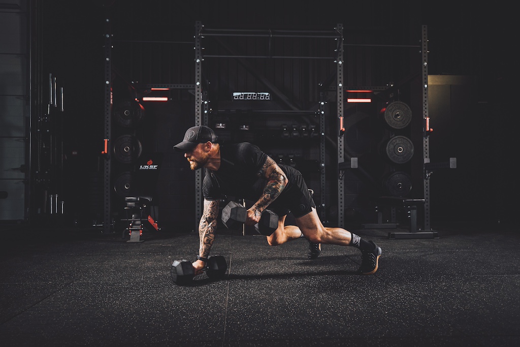 Anthony Stazicker demonstrating how to do a dumbbell man maker