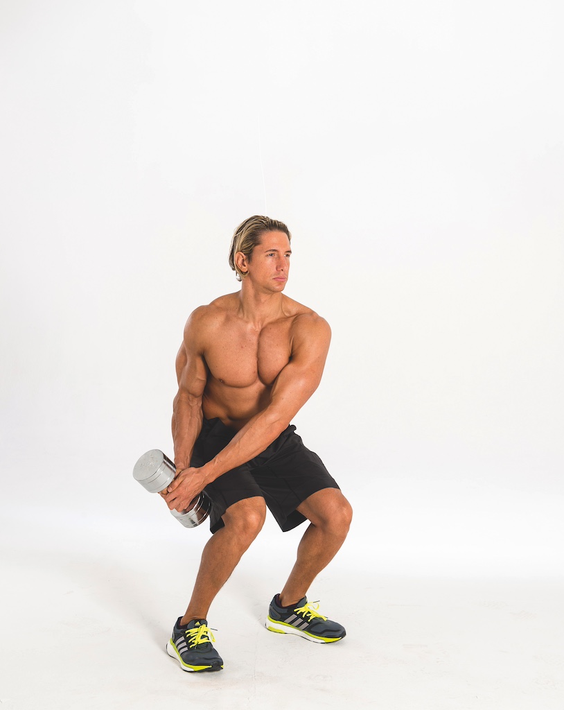 man performing dumbbell wood chop