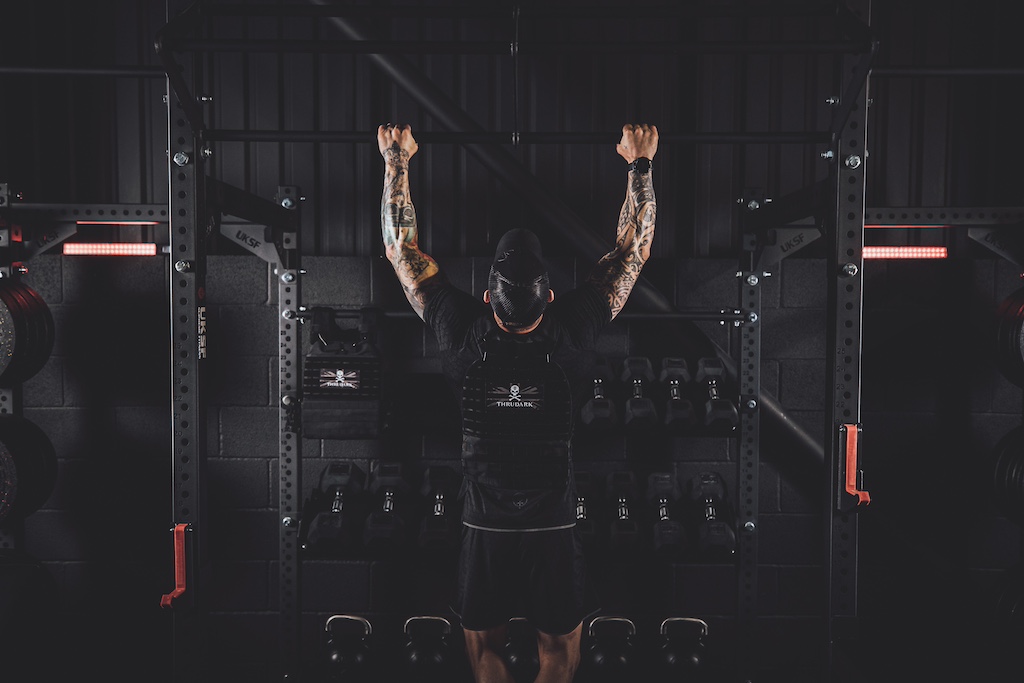 Anthony Stazicker demonstrating how to do a pull-up as part of a functional strength workout