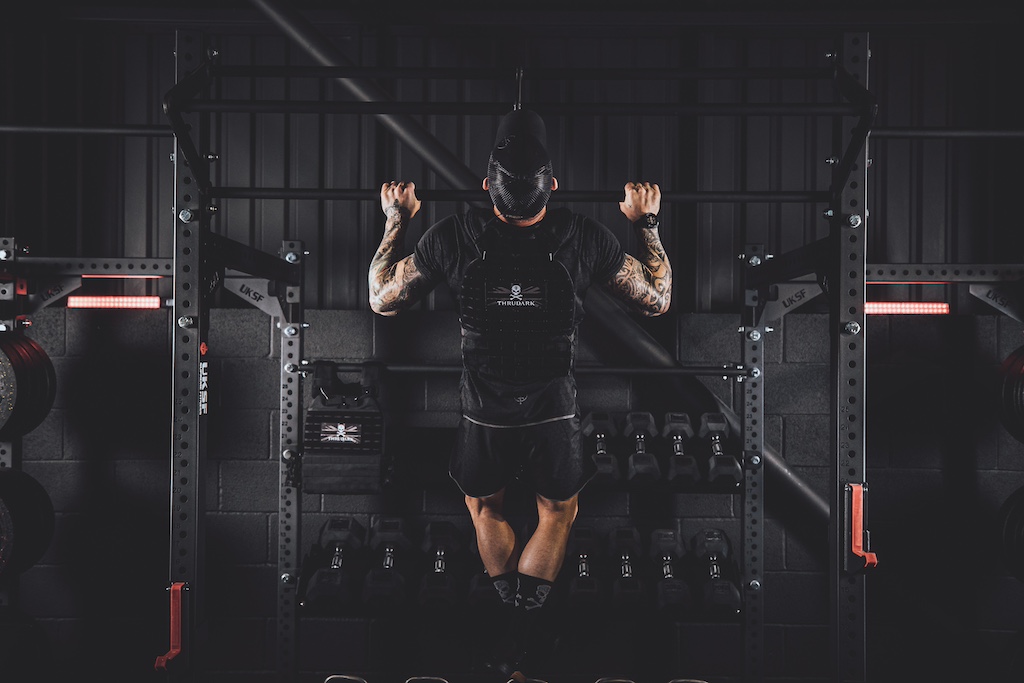 Anthony Stazicker demonstrating how to do a pull-up as part of a functional strength workout