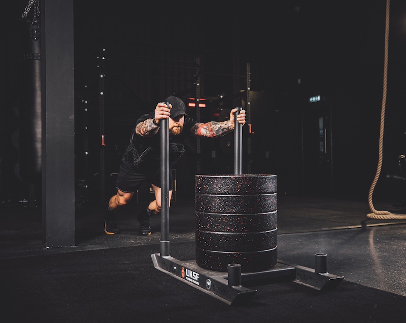 Anthony Stazicker demonstrating how to do a sled push