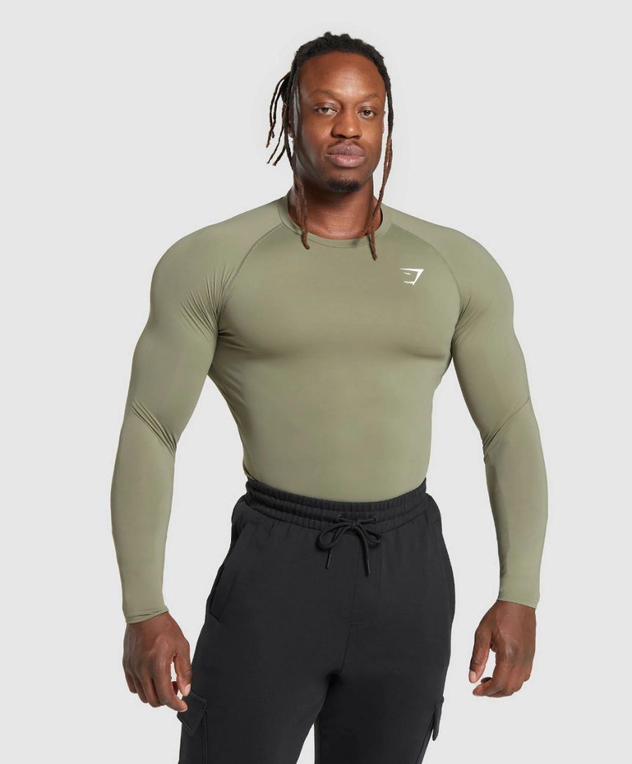 Gymshark Elemental Baselayer compression shirt, modeled in khaki.