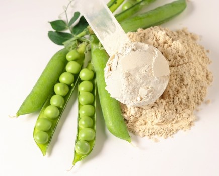 Pea pods and protein powder on a table