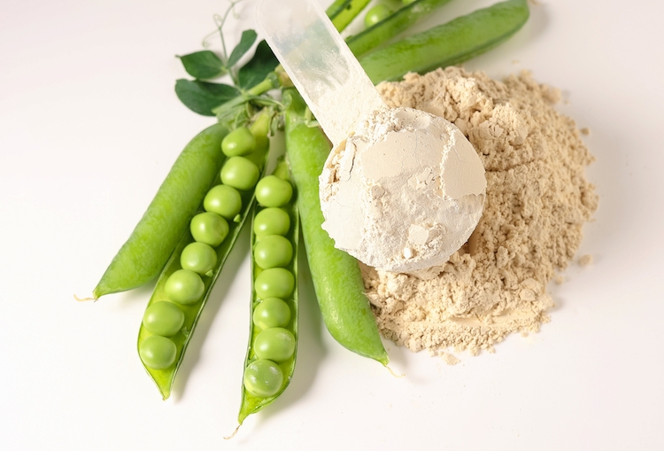 Pea pods and protein powder on a table