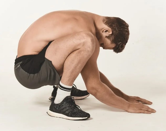 Man performing stretches for weight lifting