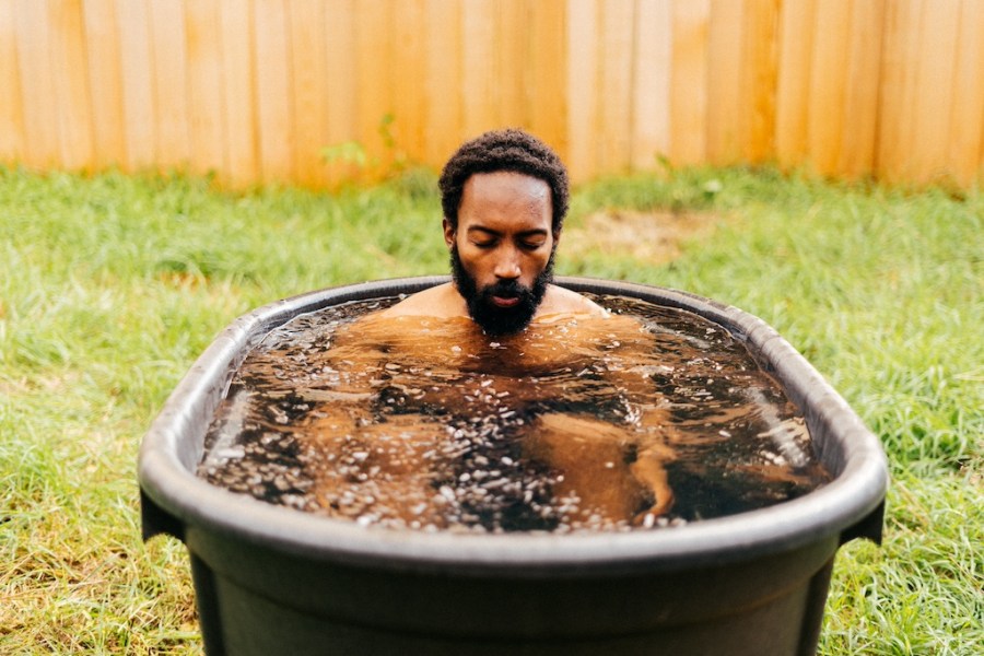 man in ice bath in garden