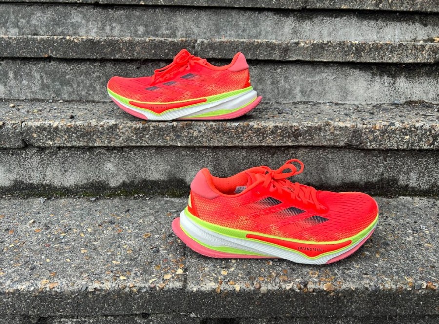 A pair of running shoes sitting on stone steps