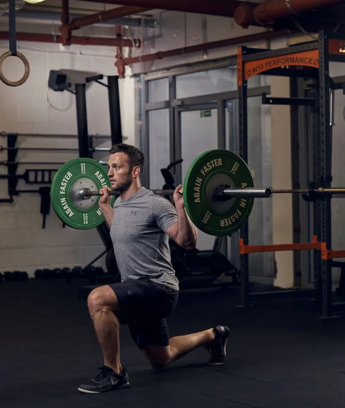 Man performing a barbell split squat