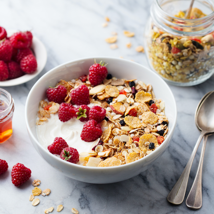 Breakfast cereal and fruit on a table