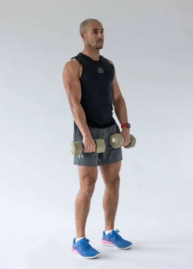 Man performing a dumbbell reverse biceps curl