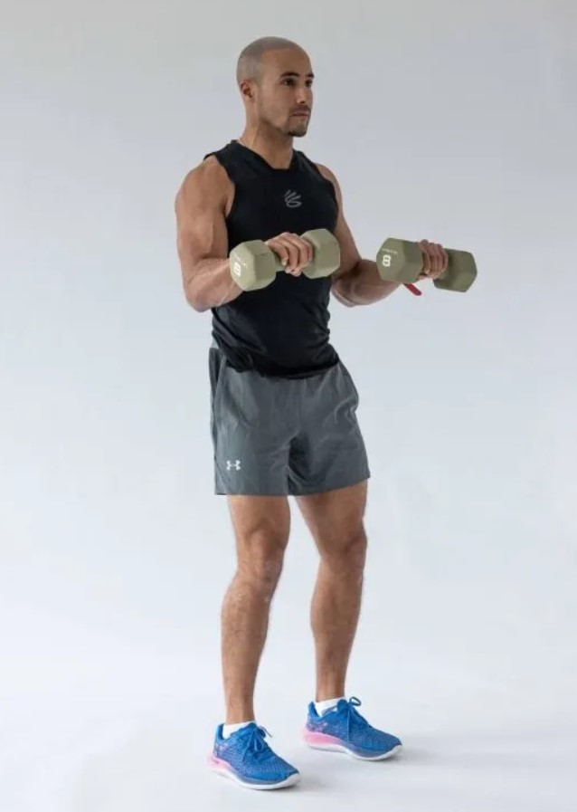 Man performing a dumbbell reverse biceps curl