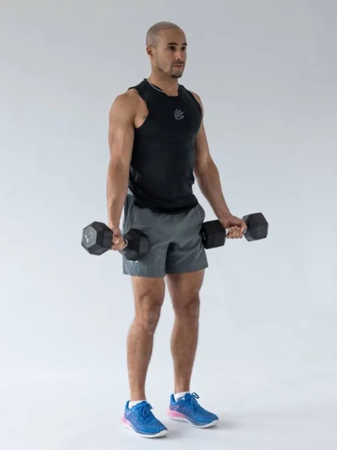 Man performing a dumbbell Zottman curl