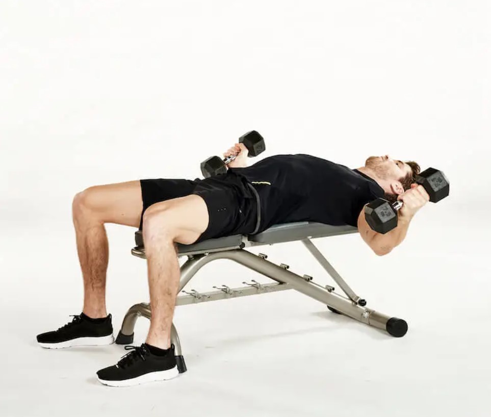 Man performing a dumbbell flye