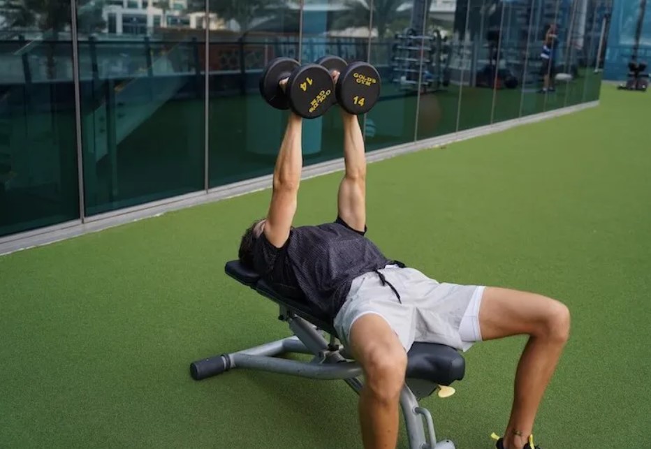 Man performing a dumbbell neutral-grip triceps press