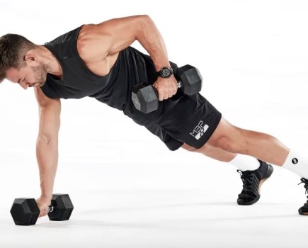 Man performing a dumbbell renegade row