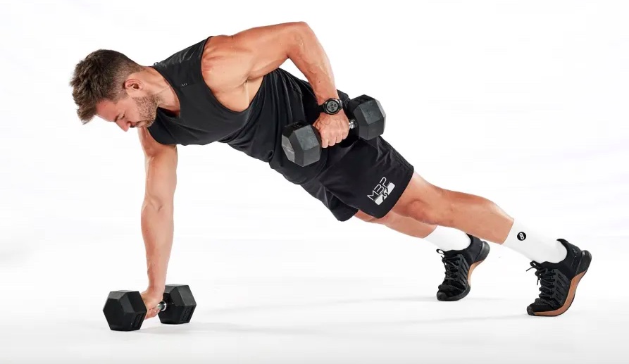 Man performing a dumbbell renegade row