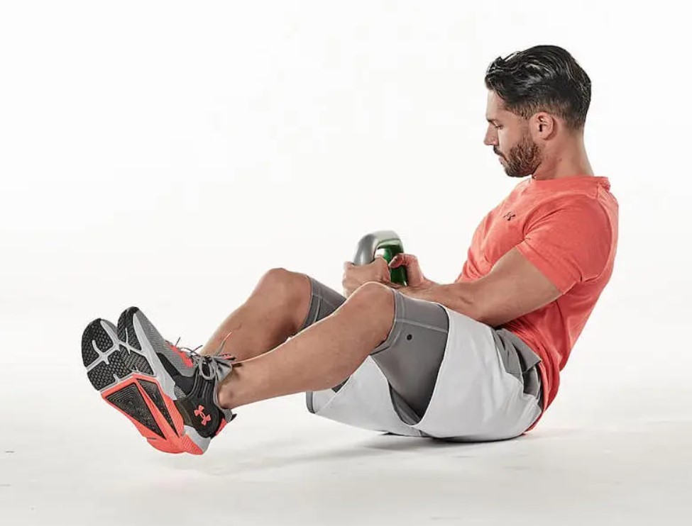 Man performing a kettlebell Russian twist